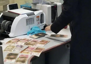 現(xiàn)金微波爐消毒被燒焦，華視錢幣消毒器保安全